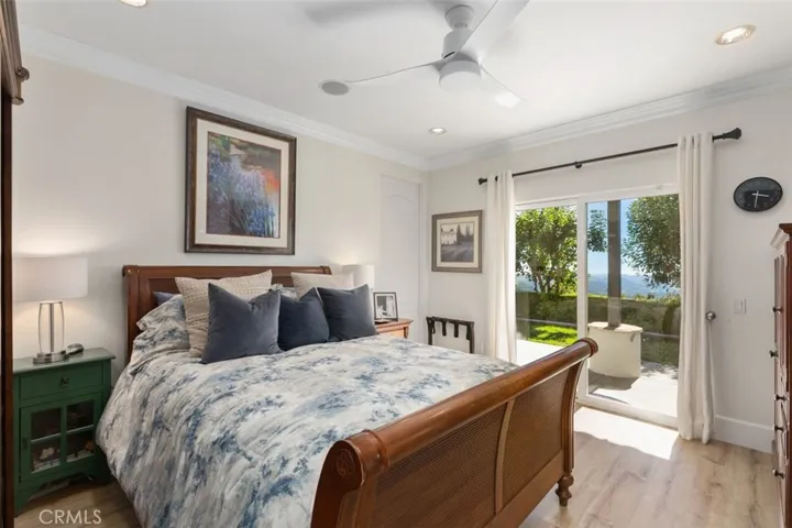 Bedroom with open views and attached bathroom.