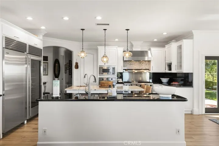 Two kitchen islands, both with sinks.