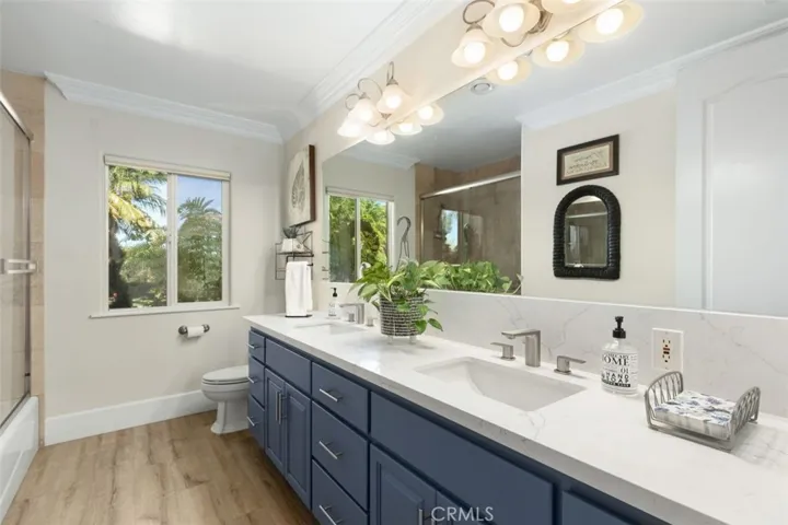 Full guest bathroom on other side of the house with quartz counters.