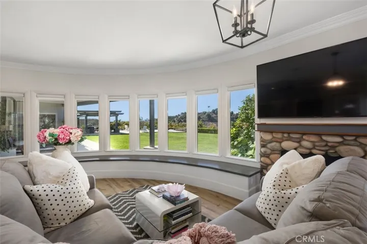 Master retreat with cozy fireplace and ample views.