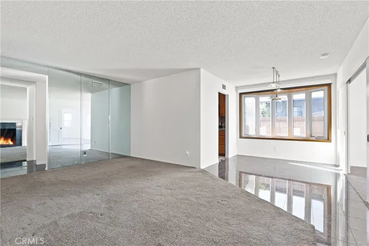 Living room and dinning area with bay window