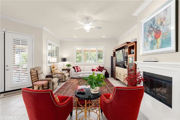 Living Room has "Walls of Glass" overlooking Lush Back Yard