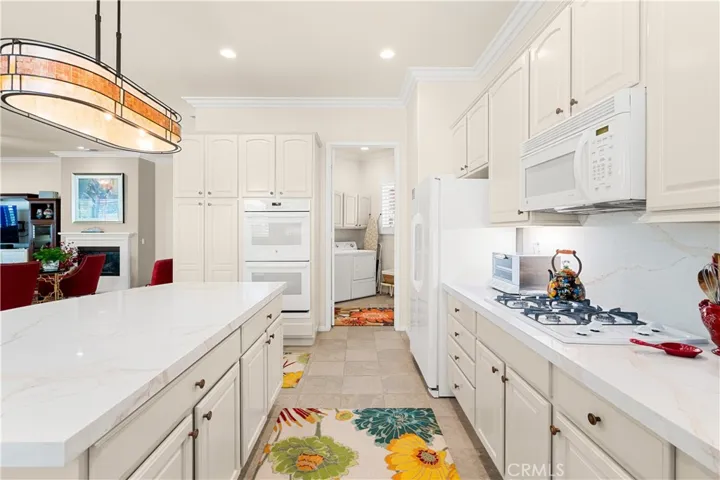 Granite Kitchen Countertops, Double Oven, Gas Cooktop, Built-in Microwave and D/W.