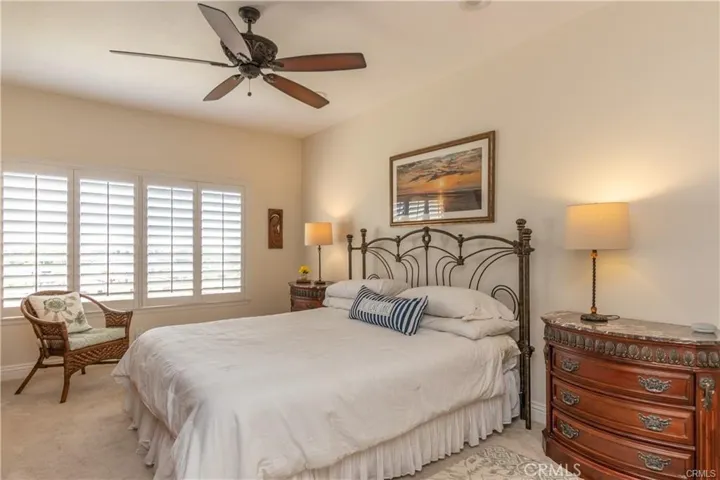 Master Suite has plantation shutters and ceiling fan