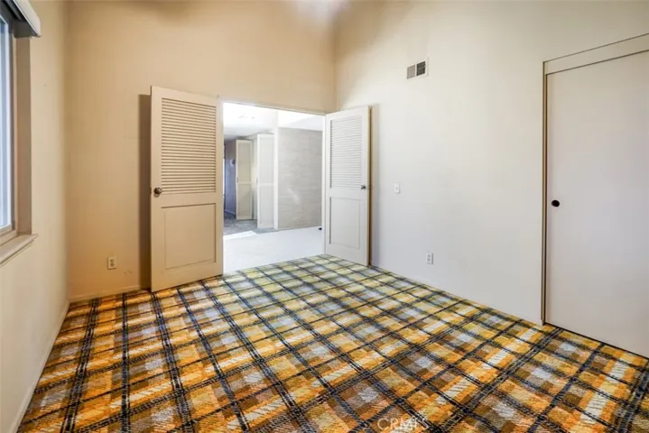 The first bedroom looking out to the entrance way.