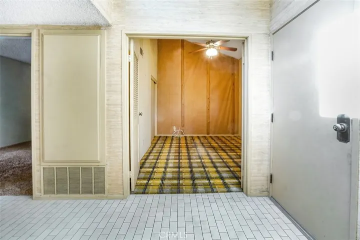 Standing in the entrance way towards the first bedroom.