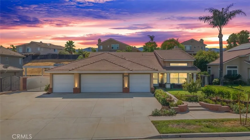 This beautiful home features a huge lot, enhanced by manicured landscaping creating a serene suburban oasis.