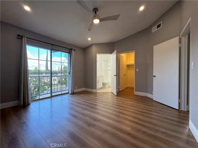 Primary bedroom with en suite bathroom and walk in closet