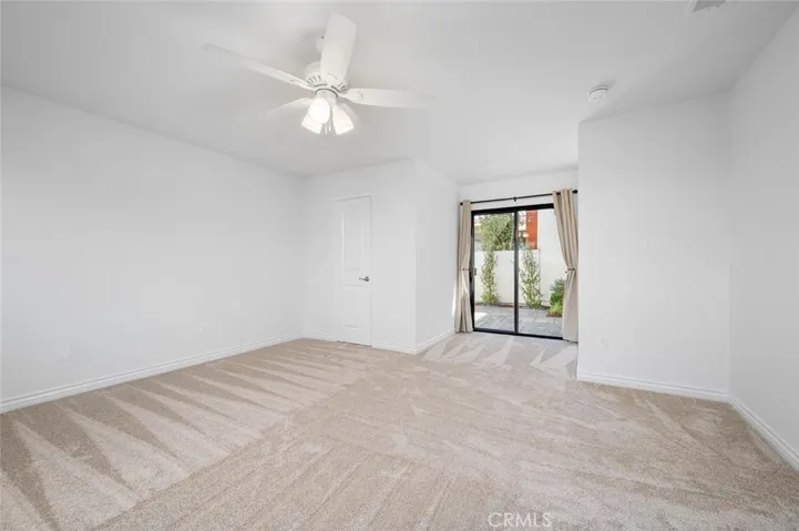 Primary bedroom opens to the rear patio