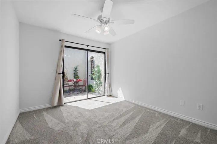 Secondary bedroom opens to courtyard