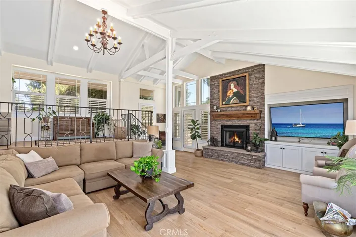 Stacked Stone Fireplace With Custom Wooden Mantel & A Cozy Hearth