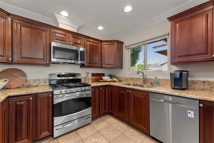 This updated space features modern appliances, granite countertops, and ample cabinetry for storage