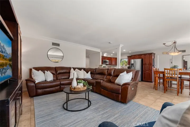 Open layout seamlessly connects family room to the kitchen, making it ideal for entertaining.