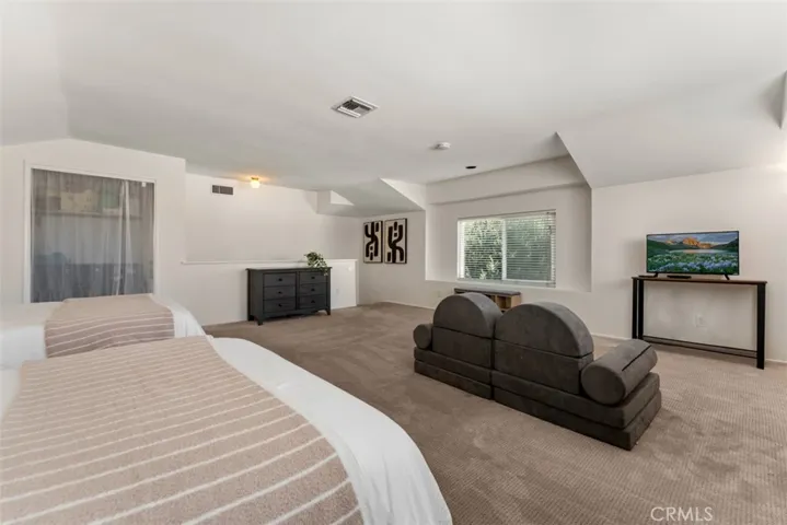 The open layout allows for various furniture arrangements, making it perfect for both relaxation and entertainment.