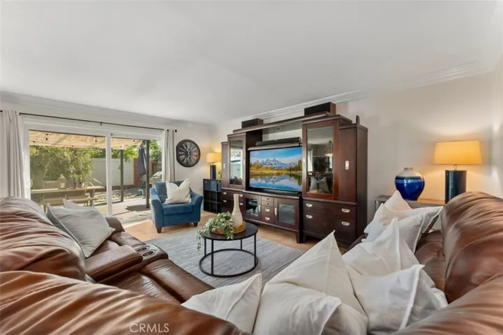 Inviting family room, which gets ample natural light from the sliding glass door that leads to the backyard.