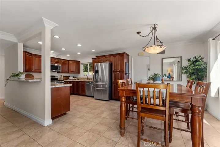 The open layout flows cohesively into the dining area, making it easy for serving.
