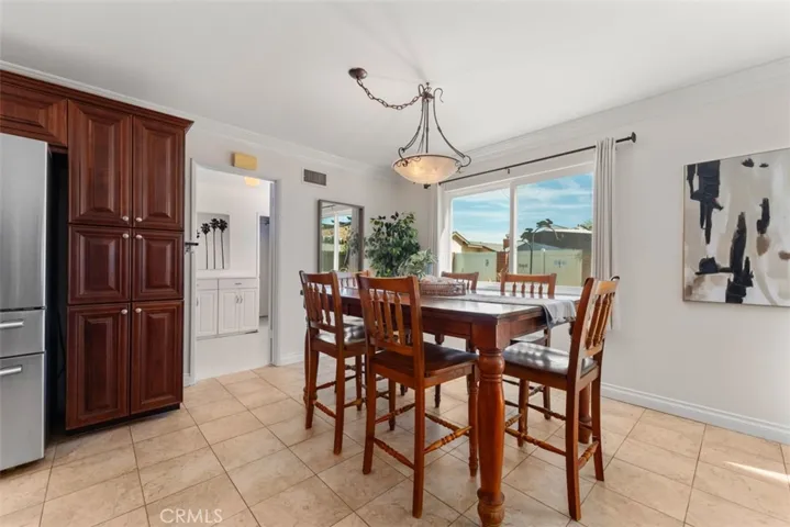 The spacious utility room that connects to the kitchen, gives easy convenience for added indoor storage.