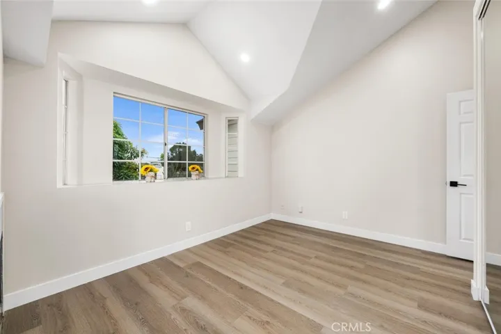 Vaulted ceilings open-up bedroom 1.