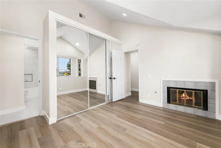 Bedroom 1 with direct access to bathroom with a warm fireplace.