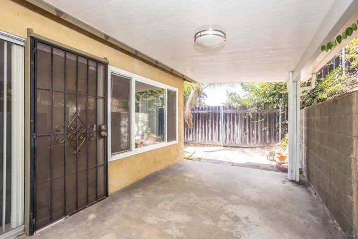 Large windows and slider to backyard.