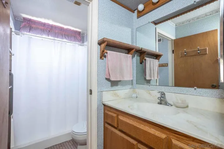 Full bath with sink separate from the tub & toilet.