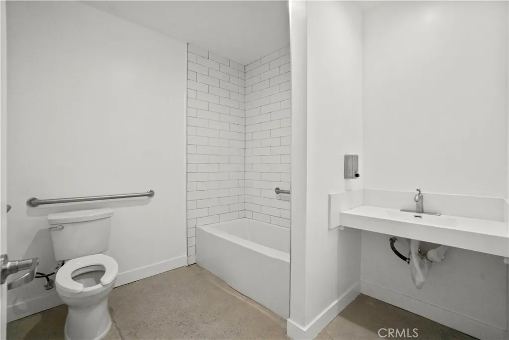 Full Bathroom with Tub and Washer and Dryer Hook ups