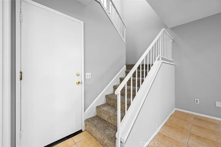 Stairs and Door to 2 Car Attached Garage