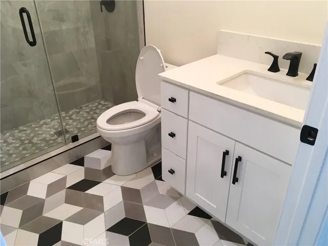 Jack and Jill family bathroom. Tile floor!