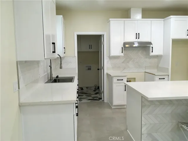 View of kitchen standing by the sink