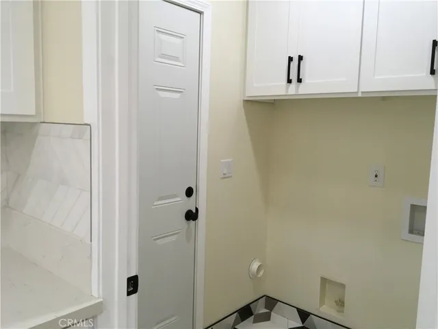 5’x5’6” laundry room.  Side door exit!
