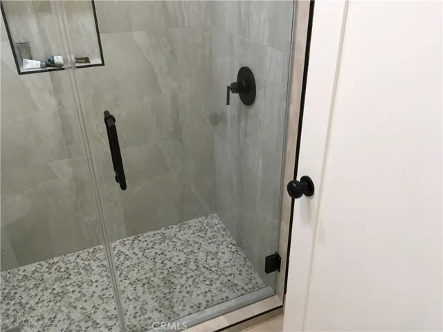 Glass enclosure, low step shower