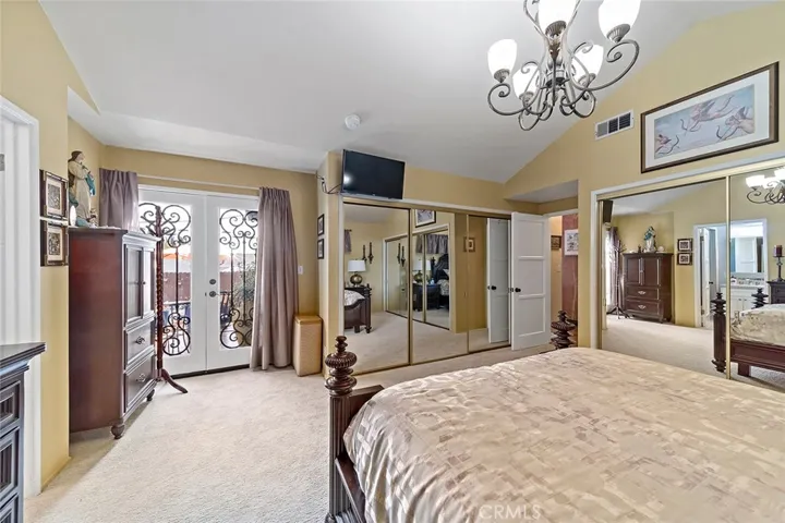His and Hers Closets. Double doors to patio