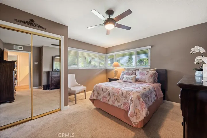 2nd bedroom with a large mirrored closet and great natural light.