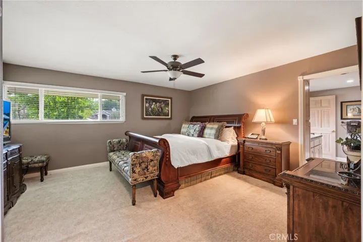 A very spacious bedroom with an attached bath and great natural light.