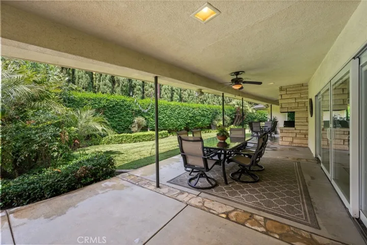A wonderful covered patio for private dining in the backyard. At the end of this patio is a built-in BBQ and a 2nd dining area.