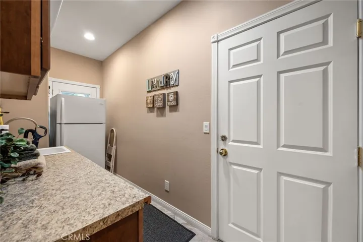 Here is the official laundry room with a door leading out to the 3 car garage.