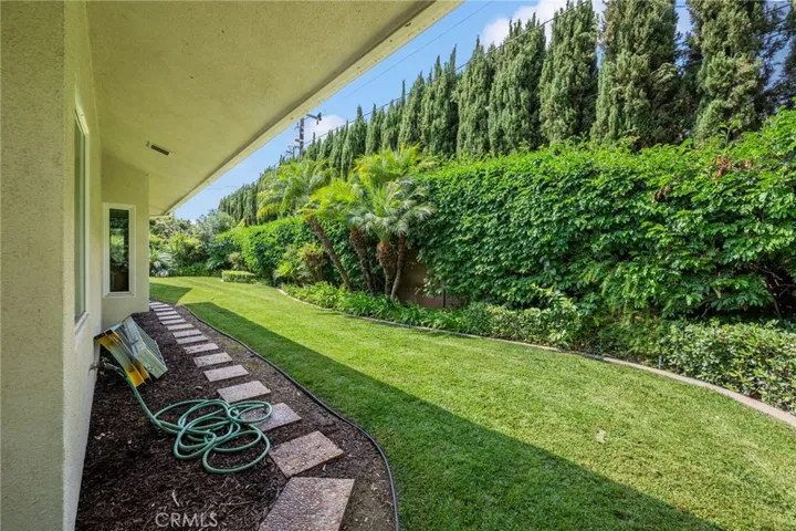 This is a part of the backyard that is completely private with all the lush landscaping.
