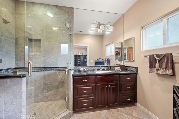 this bathroom is attached to the guest suite.