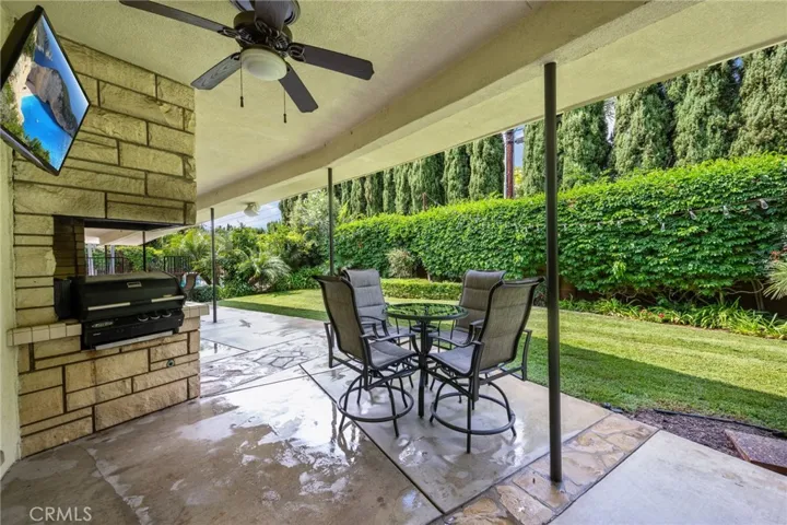 Outside TV, built-in BBQ, ceiling fans and lots of space for outdoor entertaining.