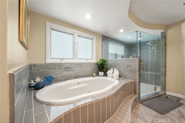 A separate soaking tub and HUGE walk-in shower, recently remodeled.