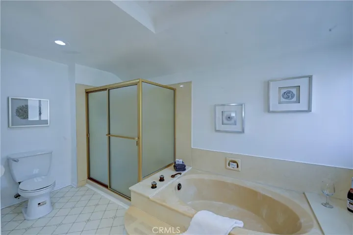 Primary ensuite bath with both a roomy shower and separate soaking tub.