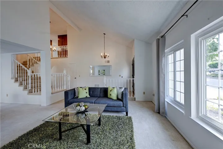 Vaulted ceiling, lots of natural light and freshly painted interior in this formal living room.