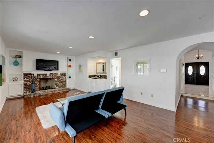 From the family room there is a hall leading to the downstairs bedroom and bath.