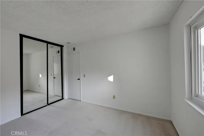 Bedroom #4 also has mirrored wardrobe doors.