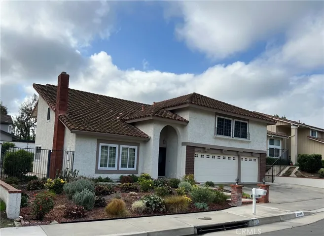 Note the drought tolerant landscaping in the front and backyards and the spacious 3 car garage.