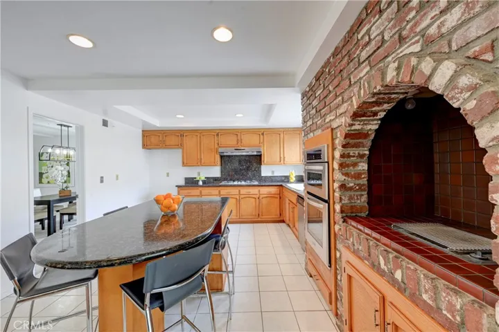 Recessed lighting and easy care flooring in this bright kitchen.