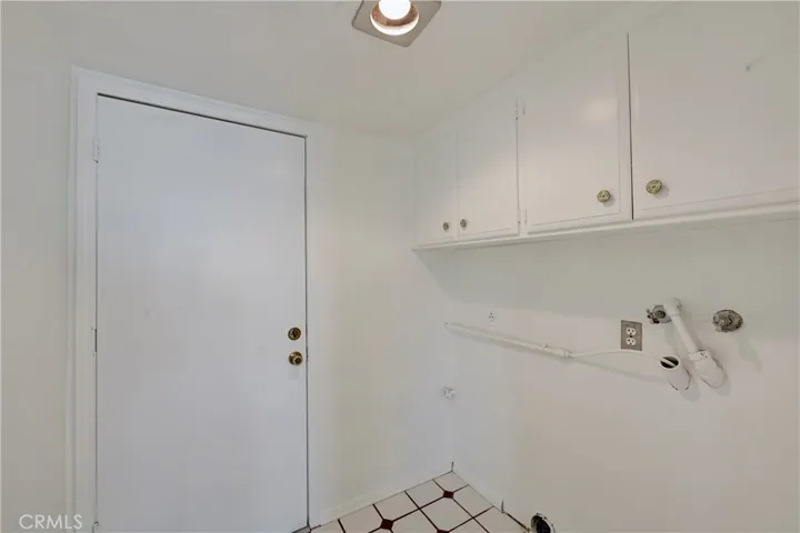 The indoor laundry room has a door leading out to the 3 car garage.