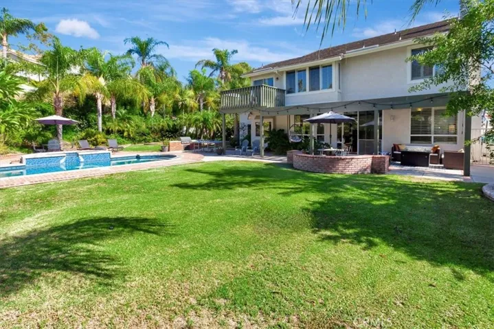 Lush lawn overlooks swimming pool