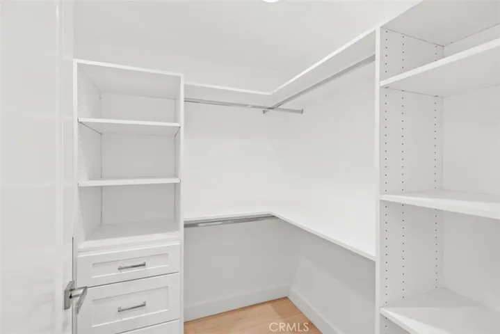 Walk in closet with built in shelving