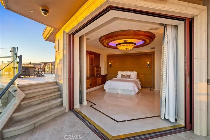 Sliding floor to ceiling glass doors pocket into the wall, allowing the ocean breeze inside.